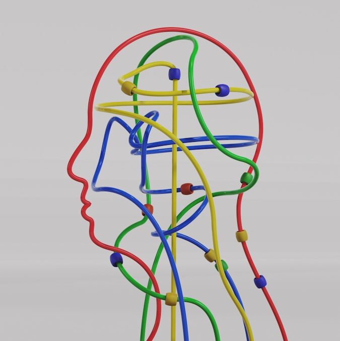 a sculpture of a man's head made of colored wires